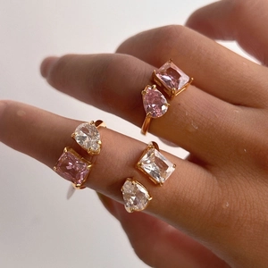 Detail of gold-plated adjustable ring featuring water drop and square-cut pink zircon