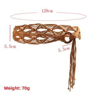 Detail of woven bohemian waist belt with brown wooden beads and tassel accents