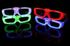 Detailed view of four LED glowing square glasses in purple, green, red, and blue colors