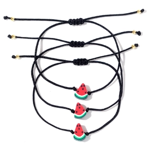 Set di tre braccialetti intrecciati neri con ciondoli anguria 3D e perline dorate