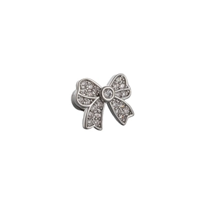Elegant silver bow stud earring with sparkling zircon crystals on white background