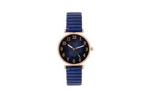Detail of blue leaf pattern dial with rose gold numerals on stretch band watch