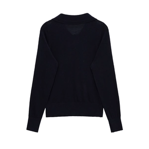 Detailed flat lay of a navy blue long sleeve knit polo sweater with ribbed cuffs