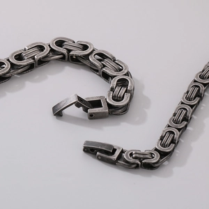 Close-up of vintage silver Byzantine steel chain links and jewelry clasp detail