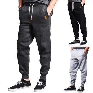Detail of drawstring waist and side pockets on men's cotton blend casual joggers