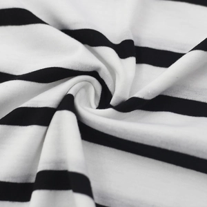 Detailed macro shot of premium black and white striped knitted fabric texture and softness