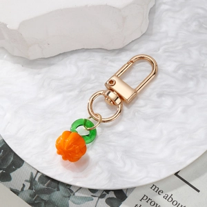 Cartoon fruit keychain with golden carabiner and orange pumpkin resin charm pendant