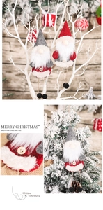 Close-up of handmade Christmas gnome ornaments with felt hats and wooden button accents
