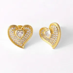 Golden heart-shaped stud earrings with sparkling zircon pave and central heart stone