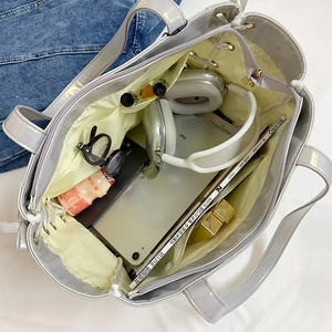 Interior view showing large capacity and compartments of the silver crossbody ita bag