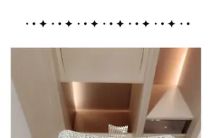 Detailed view of luxury silver clutch with crystals and crown clasp for evening parties
