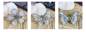 Detailed views of gold claw clips featuring zircon-studded flower and butterfly designs