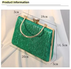 Detail view showing emerald green pleated evening bag dimensions and gold metal hardware