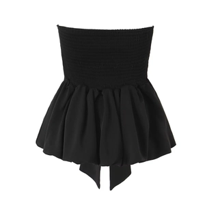 Sleeveless black bandeau top with smocked bodice and ruffled hemline in woven fabric