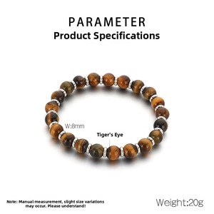 Detail of 8mm tiger eye stone beads with metal spacers showing natural eye texture
