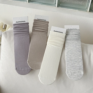 Japanese style solid color mid-calf slouch socks in purple, beige, and grey cotton
