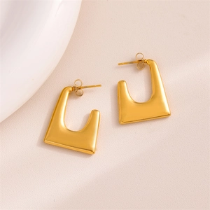 Polished gold stainless steel U-shape geometric earrings set on minimalist background