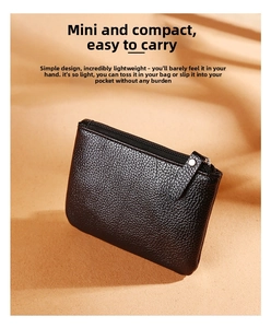 Close-up of black lychee texture PU leather coin purse with metallic zipper detail
