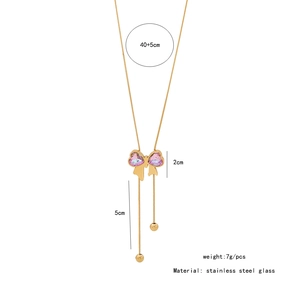 Detailed view of pink bow necklace with 40+5cm chain and 5cm tassel length specs