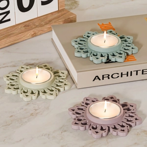 Three-piece mandala pattern candle holder set in sage green, blue and pink matte finish
