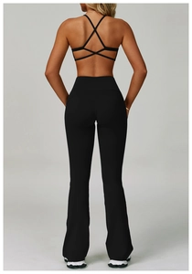 Back view of black yoga set featuring a strappy open back top and flared leggings