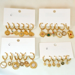 14K gold plated stainless steel hoop earrings with white shell and luck charm pendants