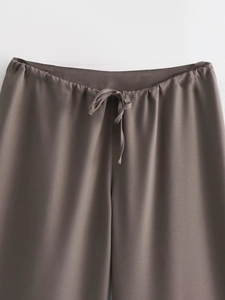 Detail of high-waist elastic waistband with adjustable drawstring on dark taupe casual pants