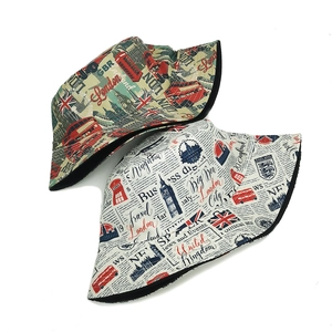 Set of two cotton bucket hats with London digital print featuring red buses and Big Ben