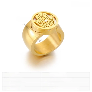 Detailed view of wide golden Hamsa Hand ring with rhinestones and Roman numerals