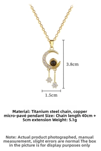 Macro shot of gold moon pendant with white zircons and titanium steel chain detail