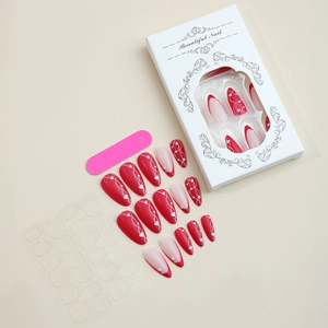 Red almond French press-on nail kit with white hearts, nail glue, and professional box