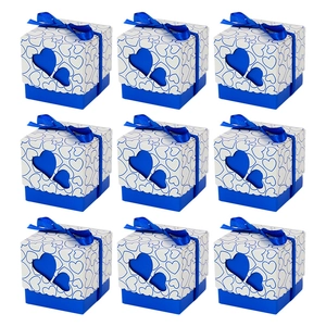 White gift boxes with blue hollow heart pattern and ribbon organized in a 3x3 grid layout