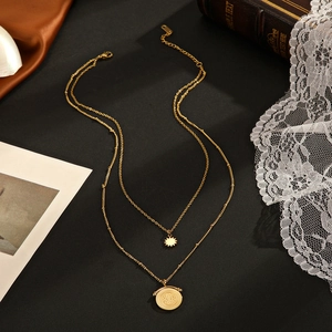 Double-layered 14K gold-plated stainless steel necklace with sun and coin pendants