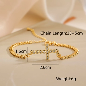 Detailed view of gold cross bracelet with cubic zirconia and cuban chain measurements