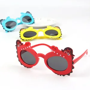 Cute crocodile-themed children sunglasses in red, yellow and blue for ages 1-6