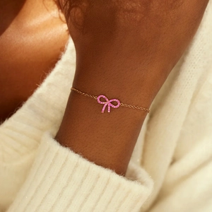 Elegant s925 silver gold bracelet with a delicate pink zircon bow charm for women