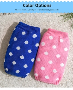 Close-up of pink and blue polka dot knitted pet sweaters with ribbed hem detail