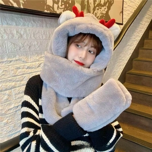 Close-up of grey plush hooded scarf with red antlers and integrated pocket gloves