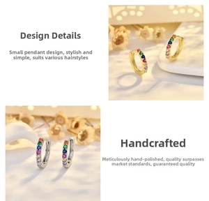 Macro shot of circular rainbow cubic zirconia earrings in gold and silver finishes