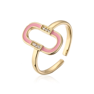 Close-up of gold plated ring with pink enamel drip oil inlay and zircon details