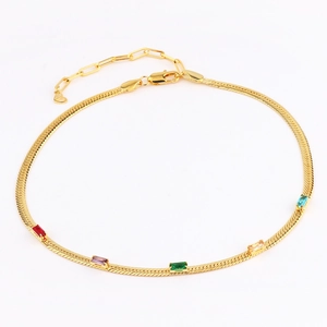 Detail of 18k gold plated snake chain anklet featuring five colorful rectangular gemstones