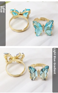 Detail view of crystal butterfly rings with rhinestones and adjustable gold bands