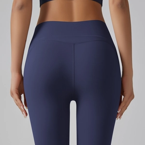 Detail view of high waist yoga leggings showing ergonomic back seams and butt lifting design