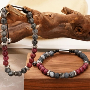 Adjustable tiger eye and labradorite beaded men's bracelets on natural wood base