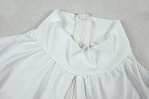 Close-up of white high-neck jumpsuit neckline with a concealed back zipper closure