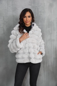 Detail of grey faux fur jacket showing thick plush texture and horizontal paneled design