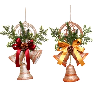 Christmas gold bells decoration set with red bows and pine cones on white background