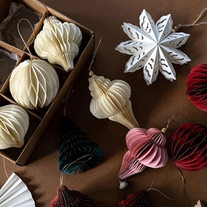 Eco-friendly honeycomb paper Christmas tree ornaments set in warm festive colors