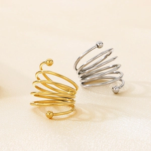 Detailed view of spiral multi-layer stainless steel rings with double beads on satin