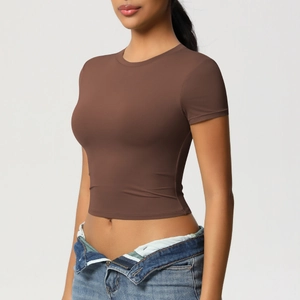 Side view of brown tight-fitting short sleeve crop top for yoga and fitness training